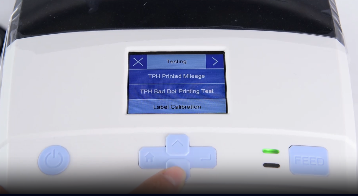 En close-up of a machine's digital interface showing a testing menu.